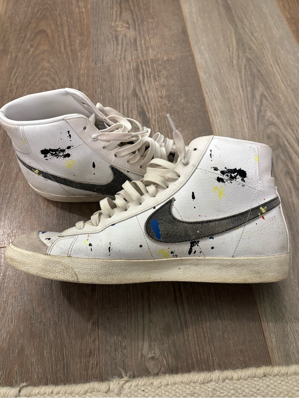 Nike White High-Top Sneakers with Gray Swoosh and Paint Splatter